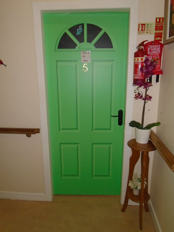 Doorcals each door is a different colour to represent A persons own space, own front door and also for colour recognition for people with dementia