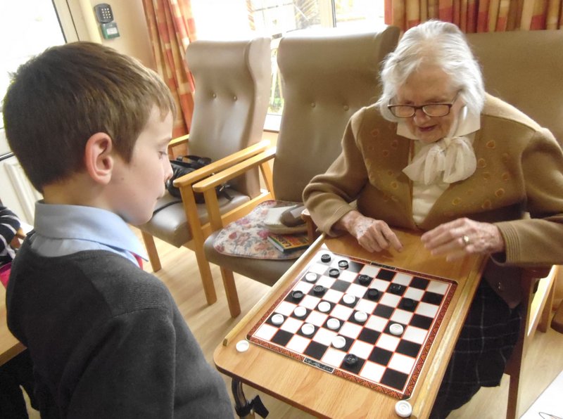 School kids interact with residents